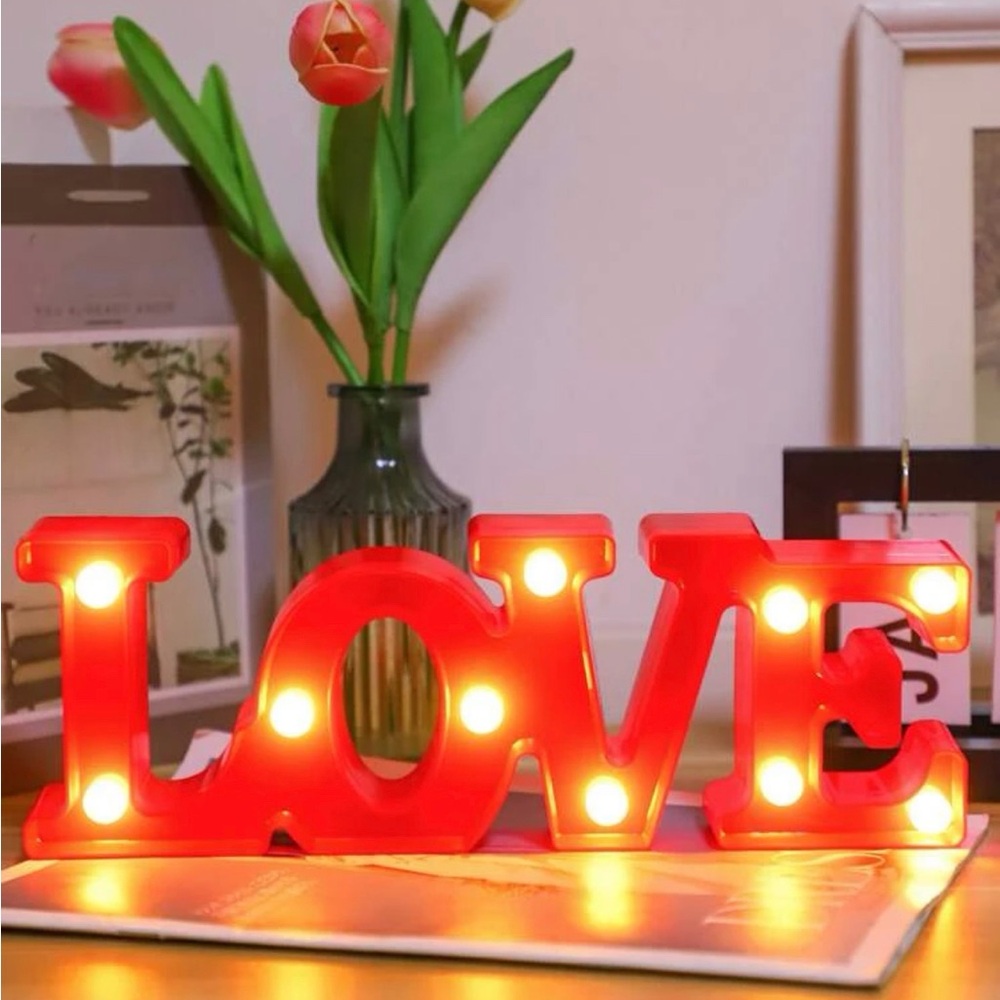 Two pink and red love sign with light